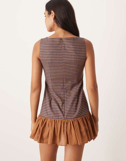 ASOS DESIGN sleeveless mini shift dress with frill hem in brown and navy plaid