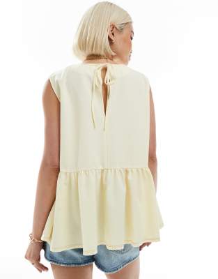 ASOS DESIGN sleeveless peplum top with tie back in yellow