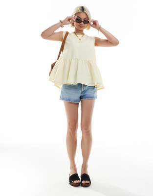 ASOS DESIGN sleeveless peplum top with tie back in yellow
