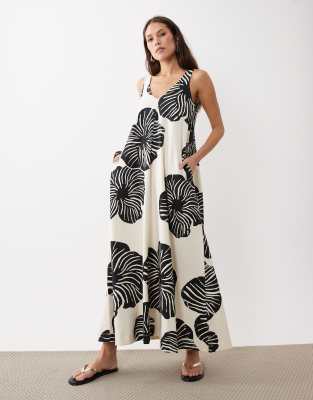 ASOS DESIGN sleeveless v-neck trapeze maxi dress in black and cream leaf print