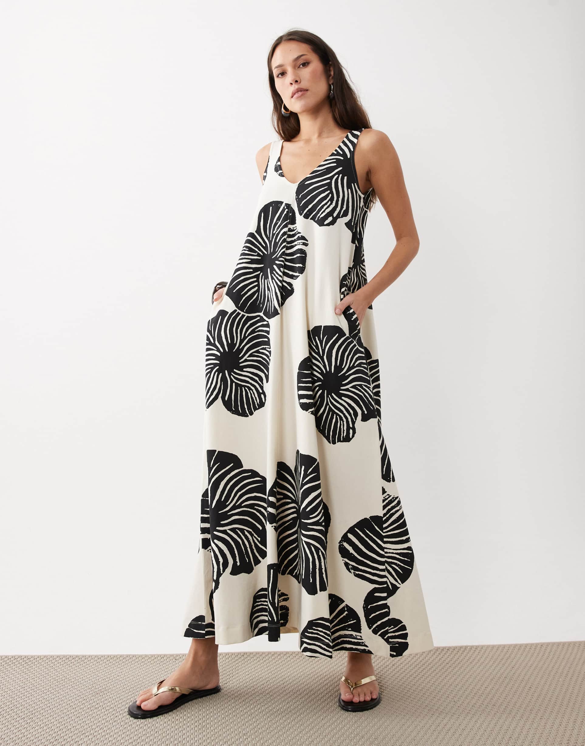 asos design sleeveless v-neck trapeze maxi dress in black and cream leaf print
