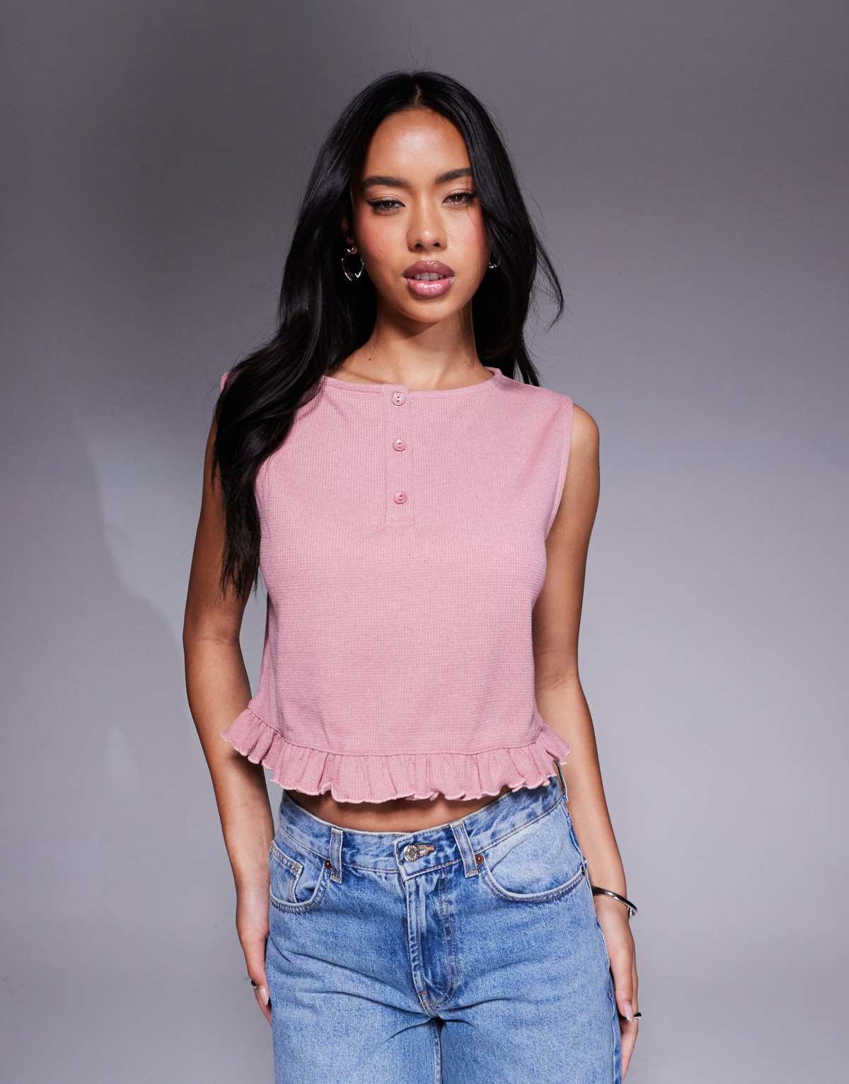 ASOS DESIGN sleeveless waffle top with frill hem in pink