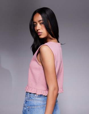 ASOS DESIGN sleeveless waffle top with frill hem in pink