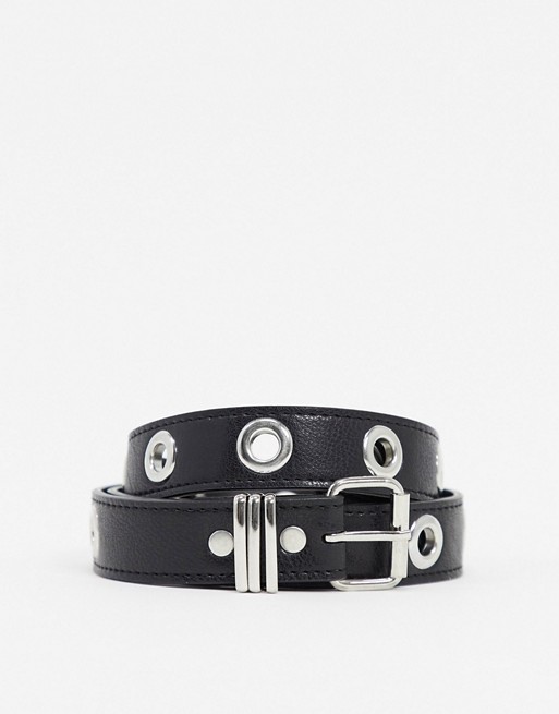 ASOS DESIGN slim belt in black faux leather with metal eyelets | ASOS