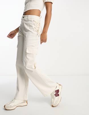 ASOS DESIGN baggy cargo pants in tan and pink with webbing belt