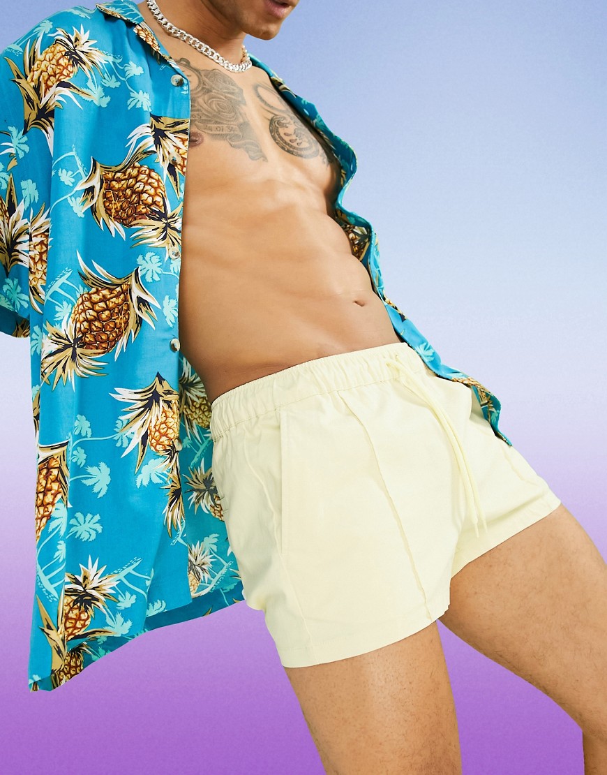 ASOS DESIGN slim chino shorts with elastic waist and pin tuck in pastel yellow