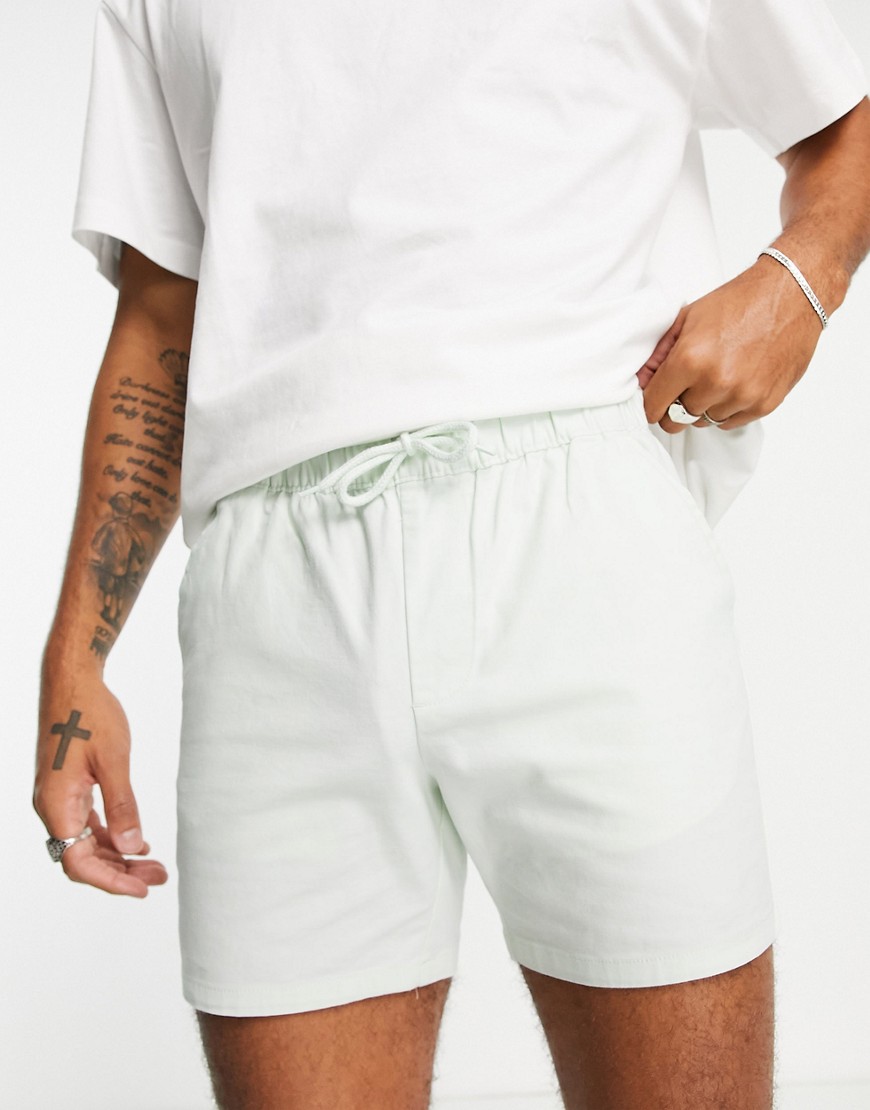 ASOS DESIGN slim chino shorts with elastic waist in pastel green