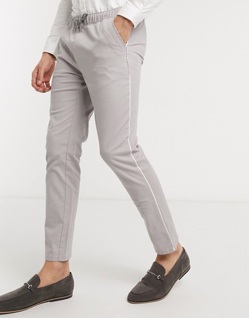 ASOS DESIGN slim chinos with elastic waist & contrast piping