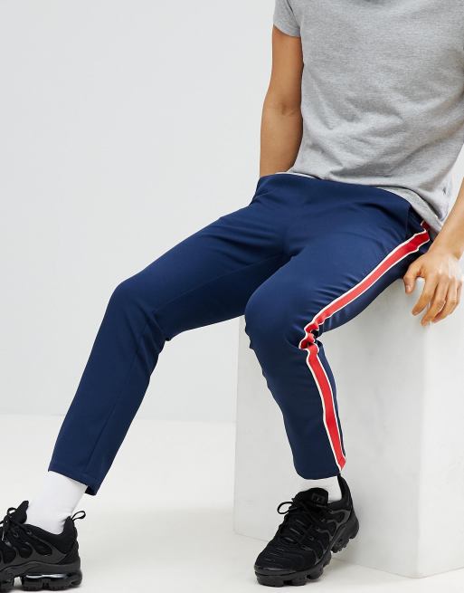 Blue trousers with hot sale red stripe