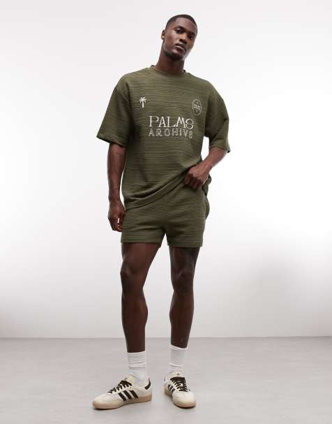 ASOS DESIGN slim crosshatch textured jersey shorts in olive green - view 1