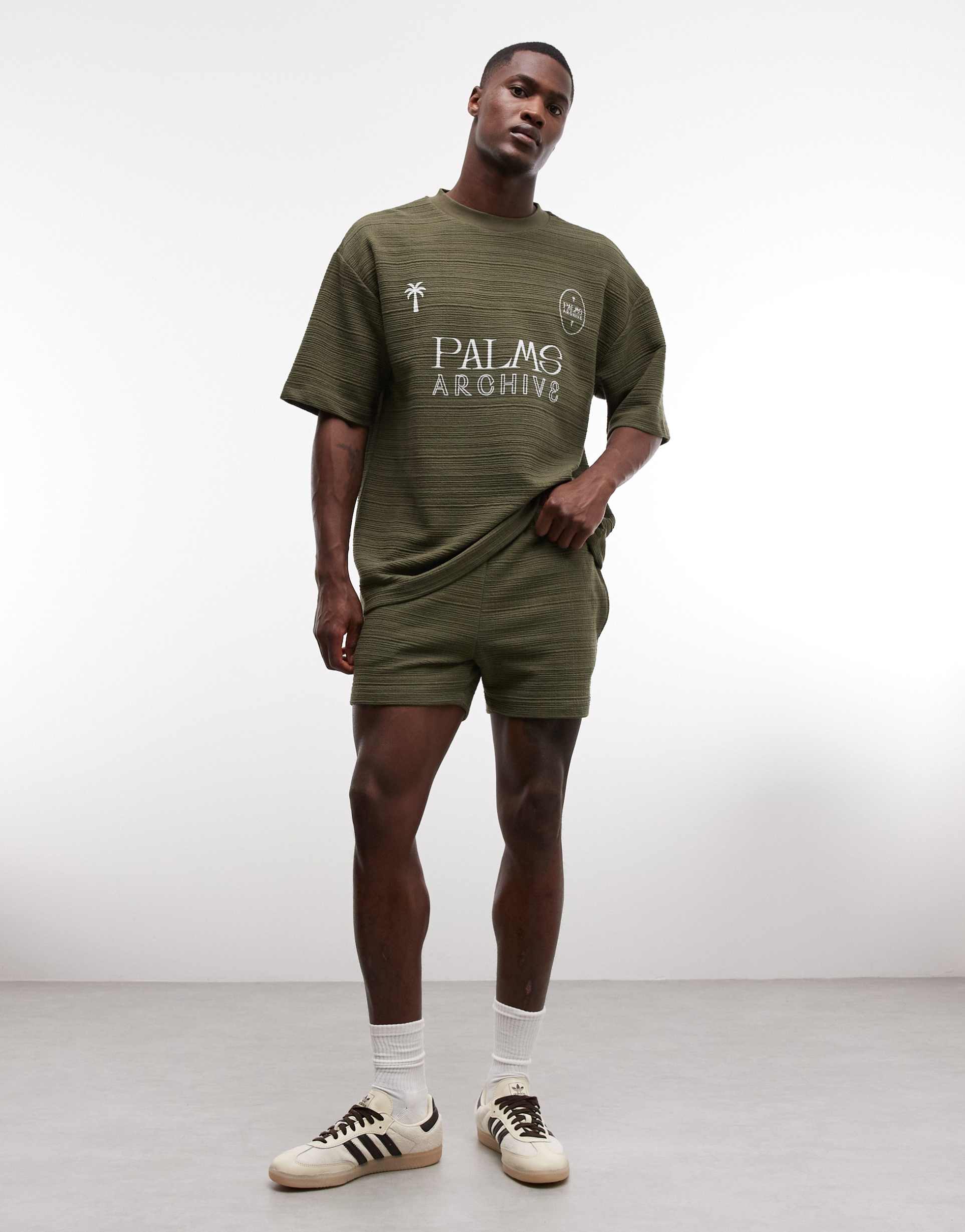 ASOS DESIGN slim crosshatch textured jersey shorts in olive green