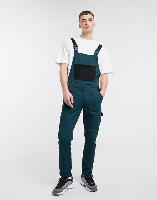 ASOS DESIGN slim denim dungarees in teal with contrast pockets and techy straps