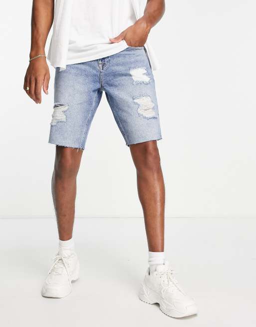 ASOS DESIGN slim denim shorts in mid blue wash with heavy rips