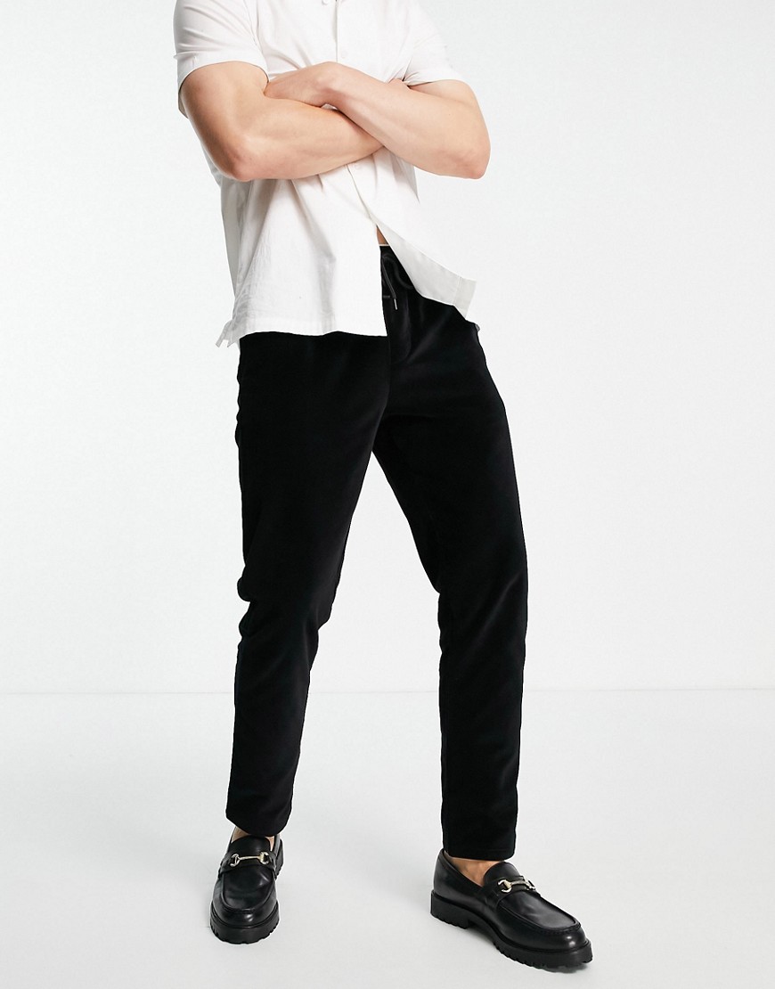 ASOS DESIGN - Slim fit broek met fluwelen look in zwart