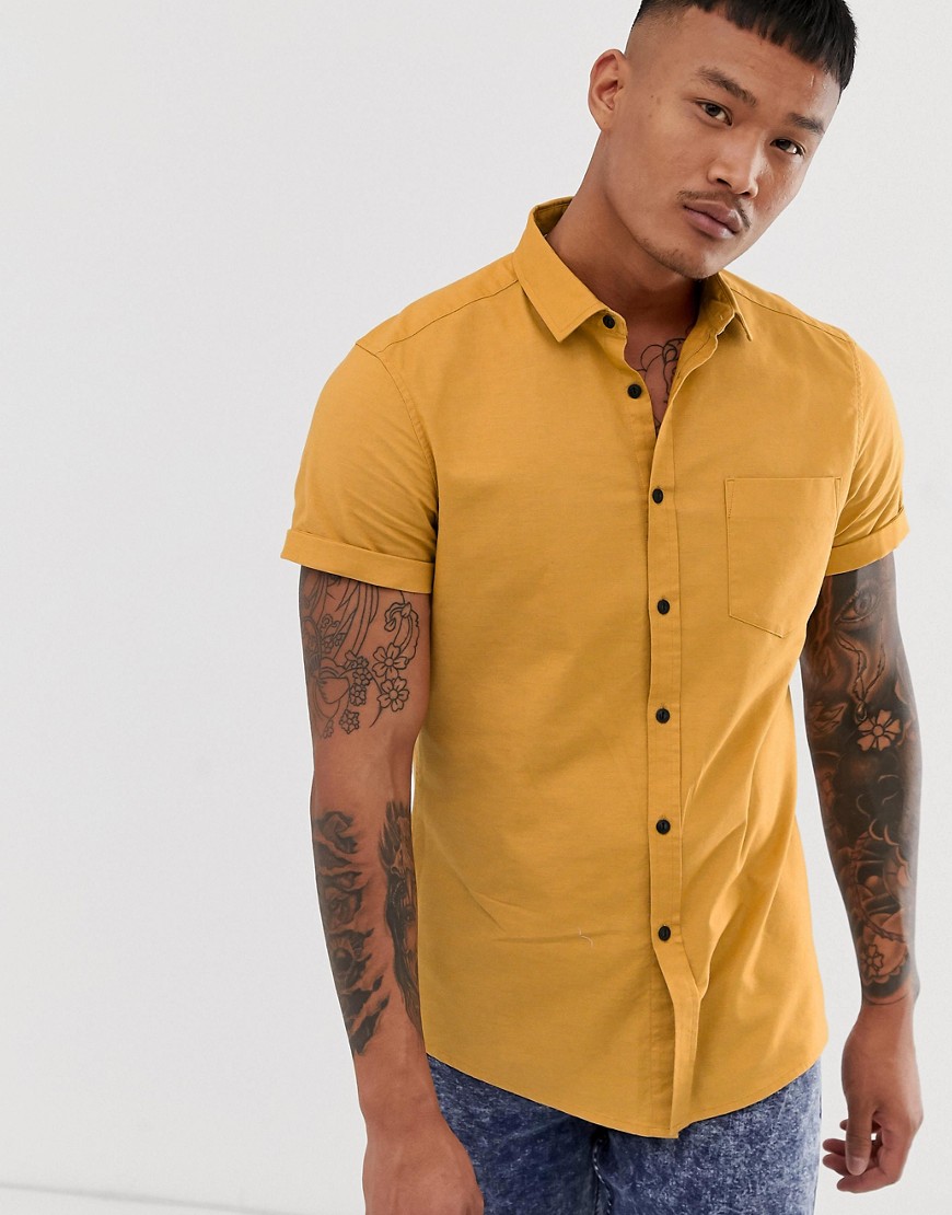 ASOS DESIGN slim fit casual oxford shirt in mustard-Yellow