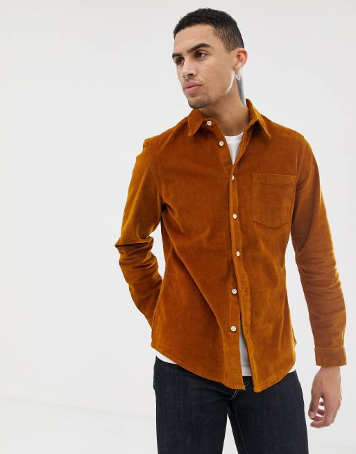 mustard shirt with blue jeans