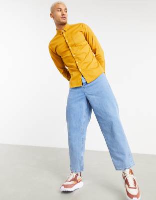mustard shirt and jeans