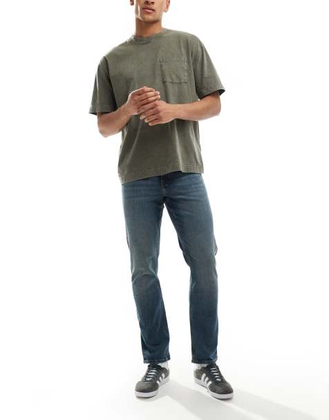 ASOS DESIGN slim fit jeans in mid wash blue - view 1