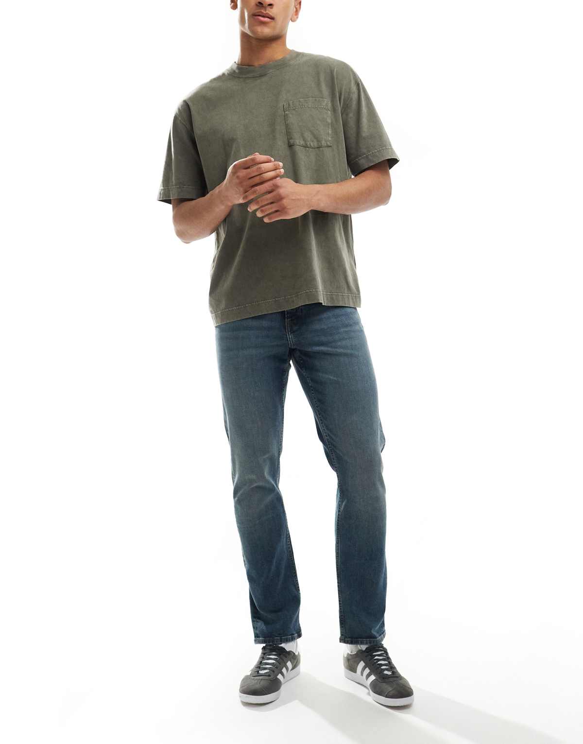 ASOS DESIGN slim fit jeans in mid wash blue