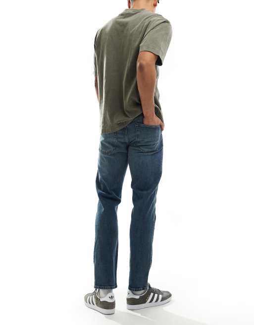 ASOS DESIGN slim fit jeans in mid wash blue, 2 of 5