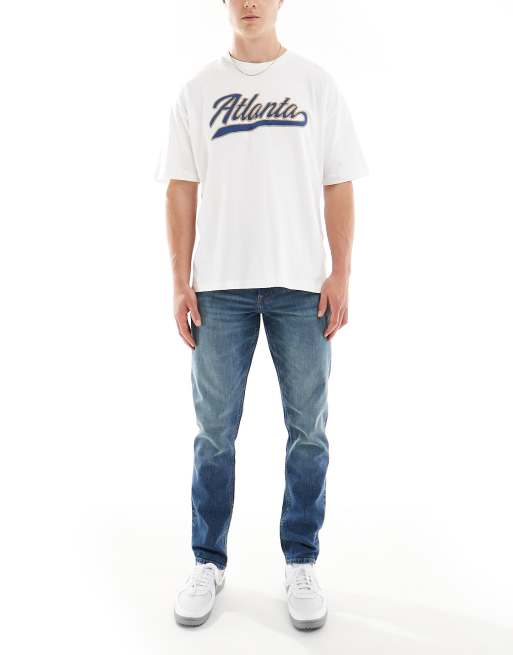 ASOS DESIGN - Slim-fit jeans in vintage blauw met donkere wassing