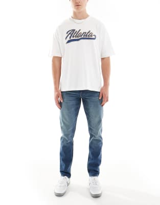 ASOS DESIGN slim fit jeans in vintage dark wash blue