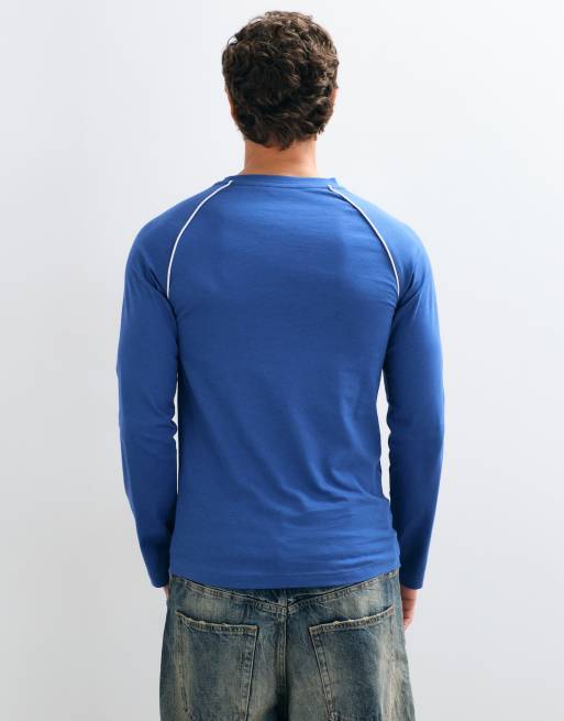 ASOS DESIGN slim fit raglan long sleeve top with piping and chest logo print in navy, 5 of 5