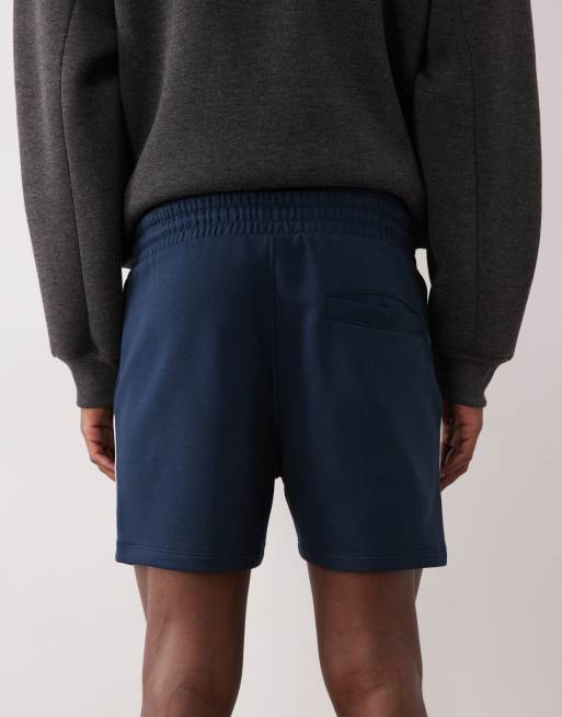 ASOS DESIGN slim fit shorter jersey shorts with contrast side piping in navy, 4 of 5