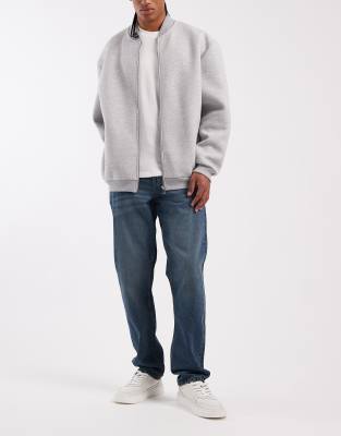 ASOS DESIGN slim jeans in dark wash blue with tint