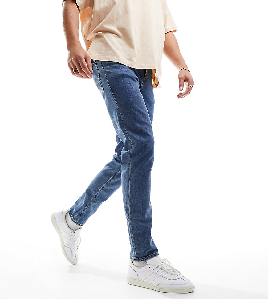 ASOS DESIGN slim jeans in flat mid wash blue
