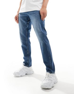ASOS DESIGN slim jeans in mid blue