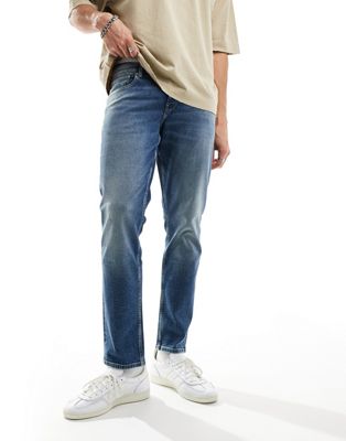 ASOS DESIGN slim jeans in mid blue