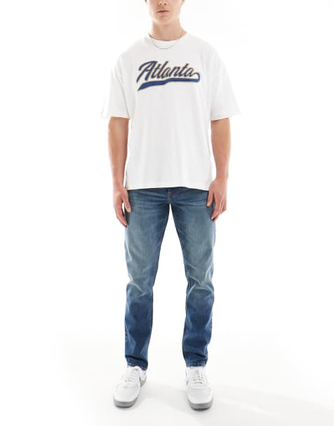 ASOS DESIGN slim jeans in mid wash blue - view 1