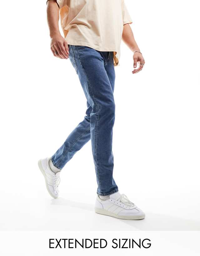 ASOS DESIGN slim jeans in mid wash blue