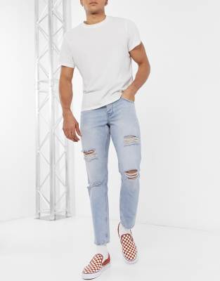 ASOS DESIGN slim jeans in vintage light wash blue with heavy rips-Blues