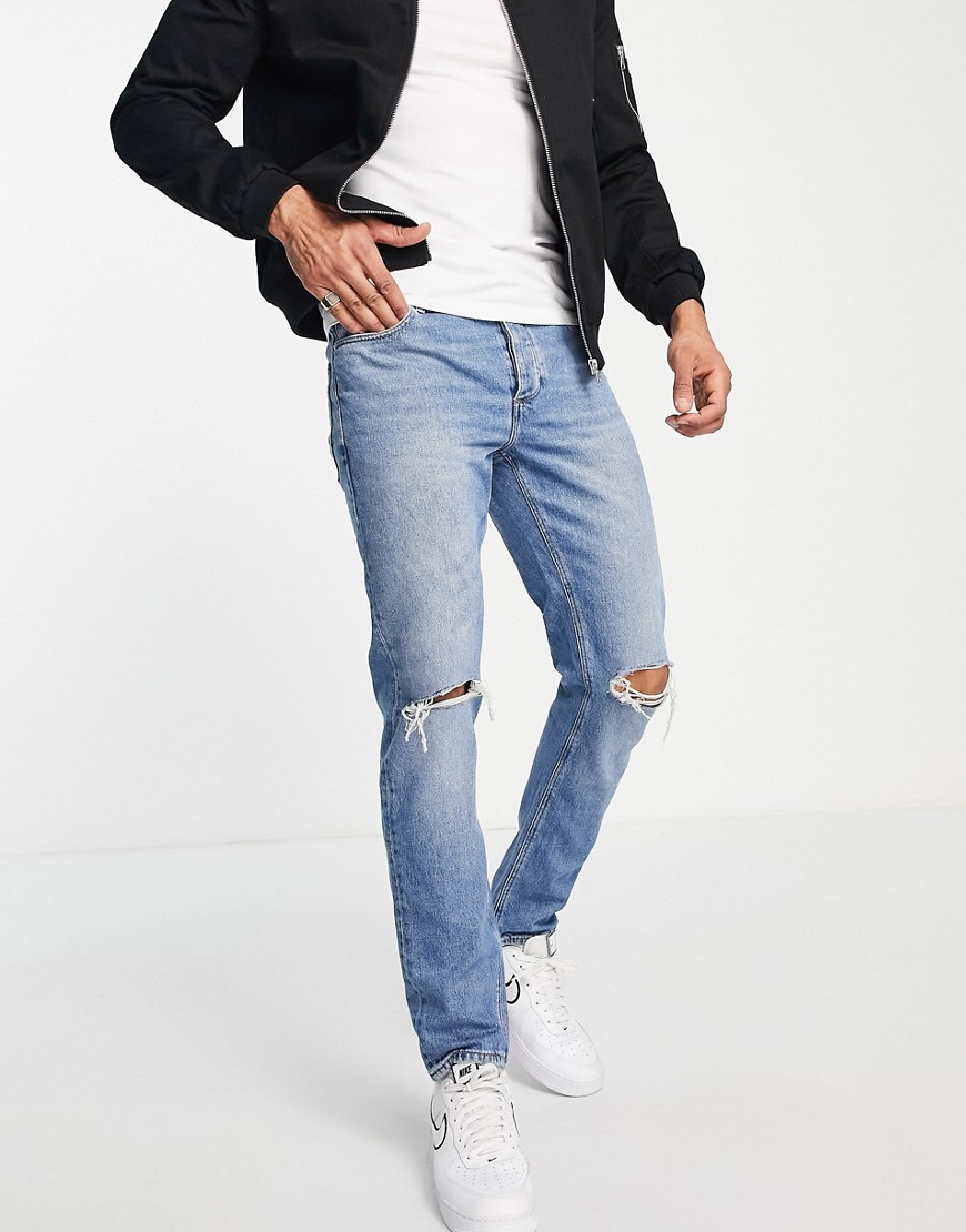 ASOS DESIGN slim jeans in vintage mid wash blue with knee rips