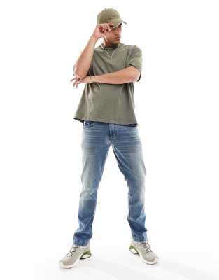 Asos Design Stretch Tapered Jeans In Blue