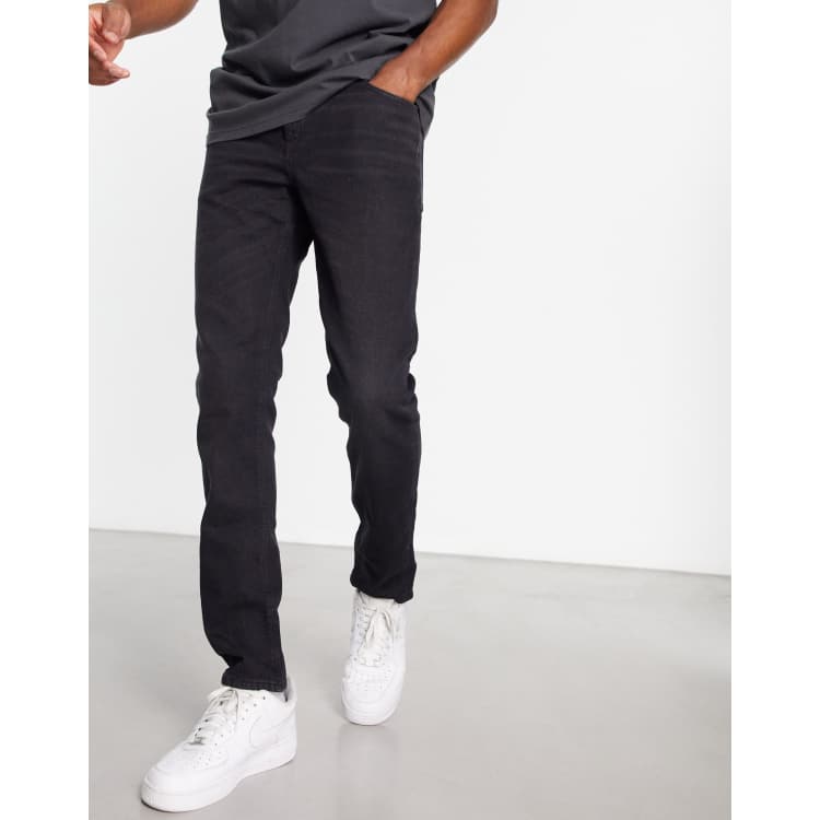 ASOS DESIGN super skinny jeans in washed black with paint splatter