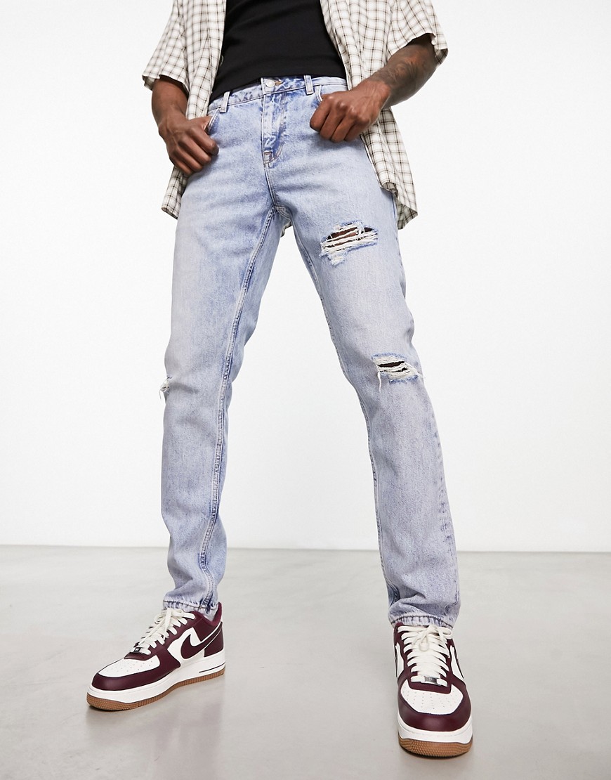 ASOS DESIGN slim jeans with rips in light wash blue