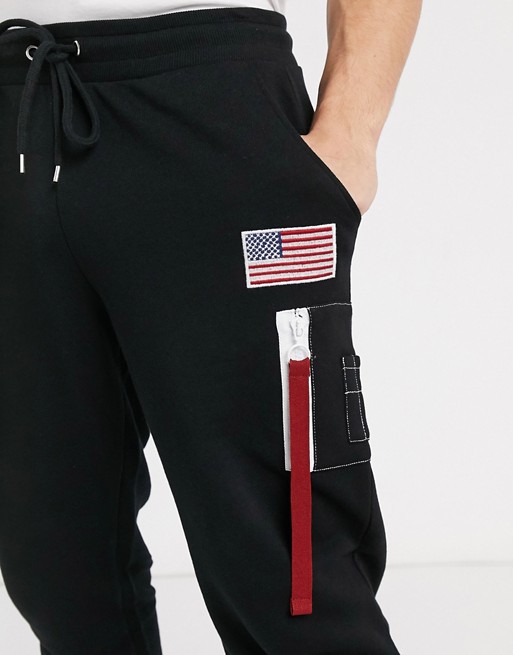 ASOS DESIGN slim joggers in black with MA1 pocket & badge detail