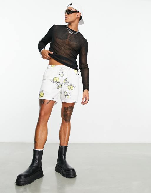 ASOS DESIGN slim linen shorts in shorter length with lemon print