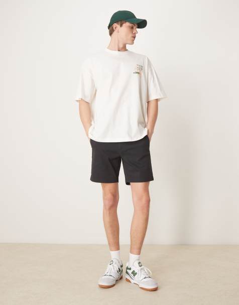 ASOS DESIGN slim mid length chino shorts in black - view 1