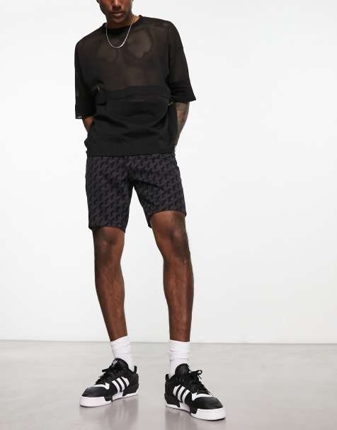 ASOS DESIGN slim mid length denim shorts in black laser print - view 1