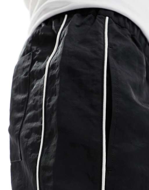 ASOS DESIGN slim nylon shorts with piping detail in black | ASOS
