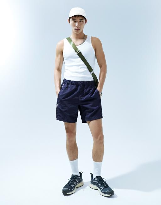 ASOS DESIGN slim nylon shorts with piping detail in khaki