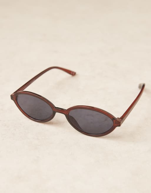 ASOS DESIGN slim oval sunglasses in crystal brown, 2 of 3