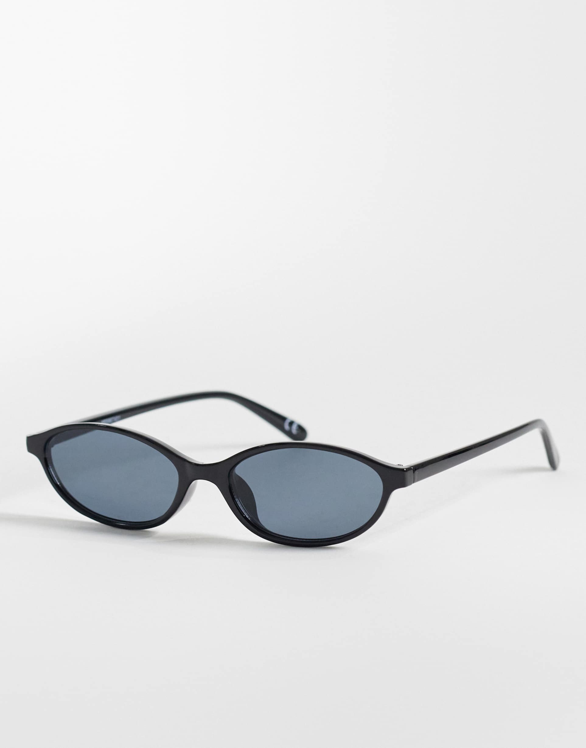 asos design slim oval sunglasses in shiny black with grad smoke lens