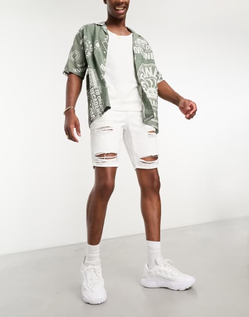 ASOS DESIGN slim regular length denim shorts in white with heavy rips