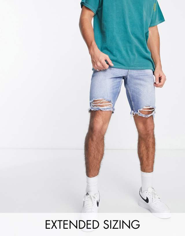 ASOS DESIGN - slim regular length denim shorts with rip hem in light wash blue