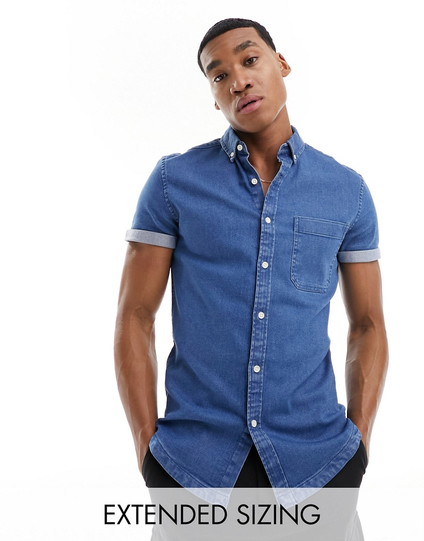 ASOS DESIGN slim roll sleeve denim shirt with button down collar in mid blue wash
